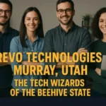 A diverse team of four smiling professionals standing together in an office, with text overlay reading "Revo Technologies Murray, Utah - The Tech Wizards of the Beehive State."