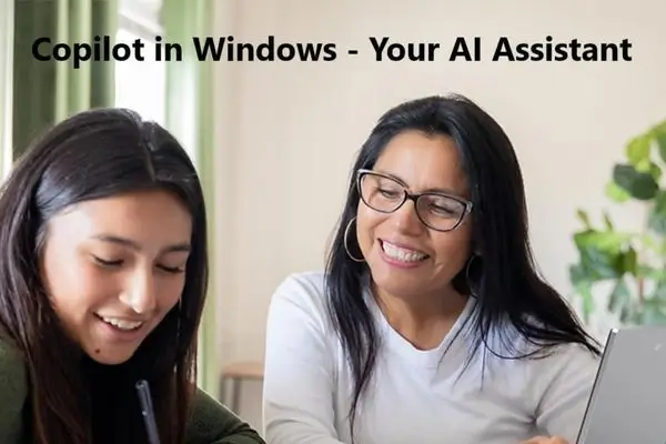 Two people smiling while using a laptop with text promoting Copilot in Windows.