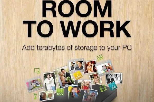 Seagate external hard drive with "ROOM TO WORK – Add terabytes of storage to your PC" text and collage of photos, videos, music, and documents spilling out, showcasing huge capacity for media and files.